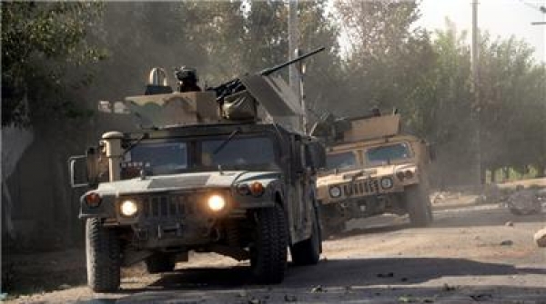 Afghan security officials patrol in Aachin district of Kunduz, Afghanistan 