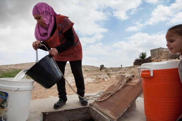 Woman stocking up for water