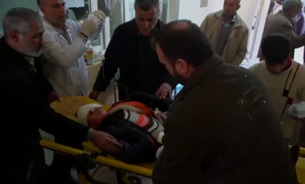 One of the wounded is being treated by locals and medics