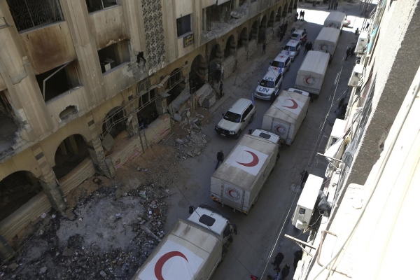 Aid convoy driving through the streets of Douma, Eastern Syria 