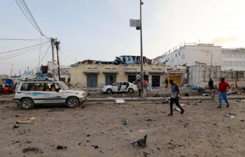 The aftermath of the explosion of three bombs in the streets of Mogadishu.  