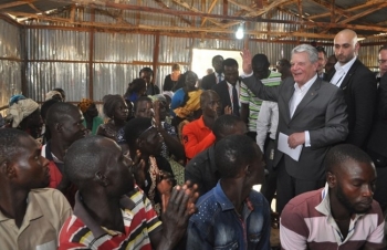 Germany&#039;s President Joachim Gauck during a visit to a camp of displaced people on the outskirts of Abuja, Nigeria.