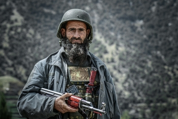 Soldier holding a gun in Kunar, Afghanistan