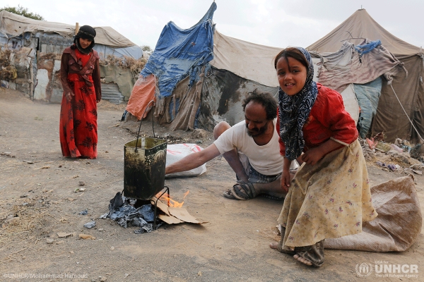 Internally displaced people are forced to make makeshift shelters with scrap wood and plastic tarps