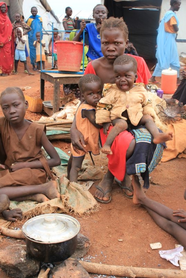 A 27 years old woman with her sons in a UN peacekeepers&rsquo; protected site in Wau, South Sudan. 