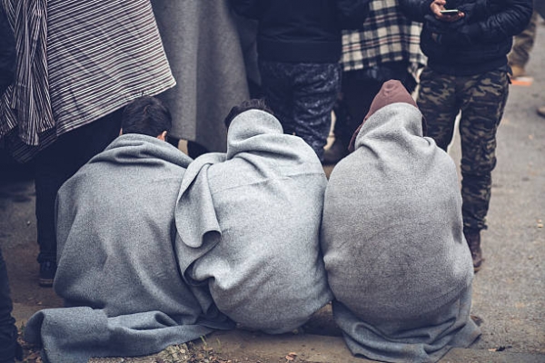 Yemeni find shelter in a blanket.