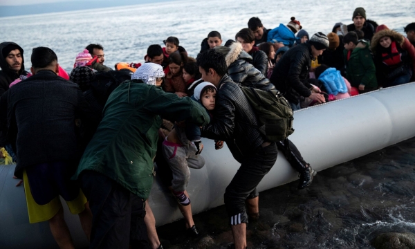 Migrants from Afghanistan arrive on a beach near the village of Skala Sikamias on the island of Lesbos. 