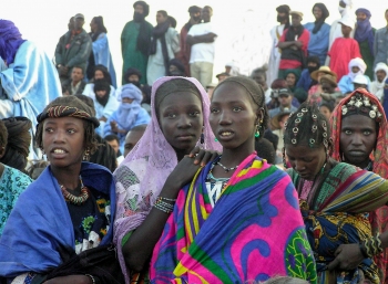 A group of people standing next to each other
