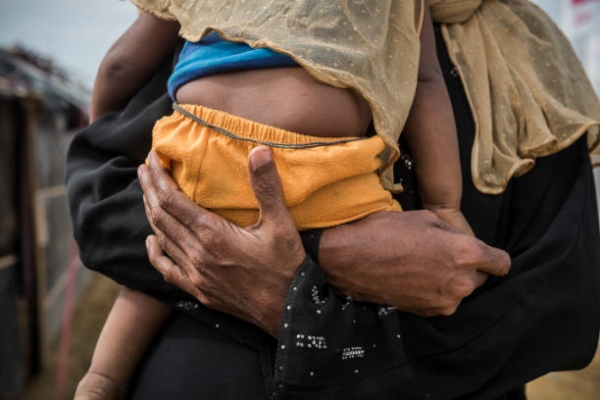 A mother holding a child