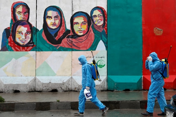 Volunteers prepare themselves to spray disinfectants on streets in Kabul, Afghanistan