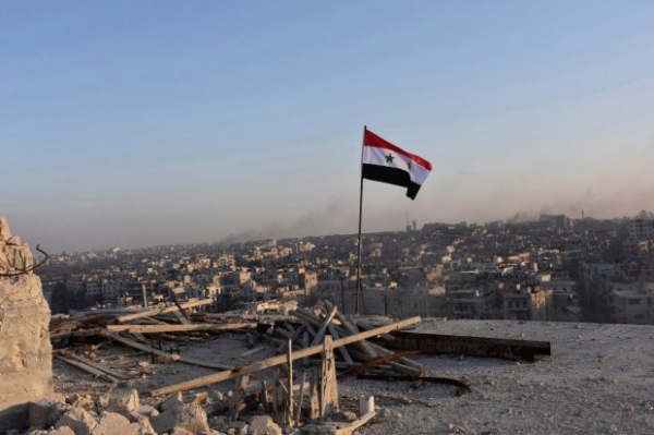 An abandoned Syrian flag; it's people search for hope