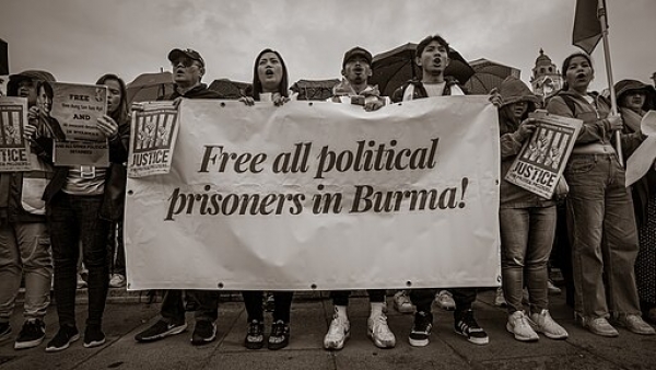 Activists in London with a banner calling for the freeing of all political prisoners in Burma
