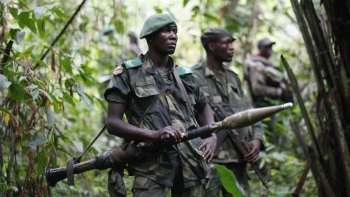 DRC soldier stands guard