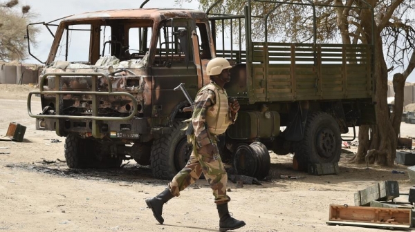 Nigerian soldier assesses the aftermath of the attack on Felo, Borno State