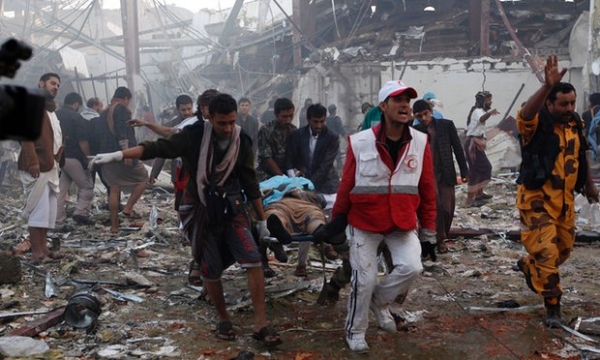 Aid workers rush to help after an explosion at the Sanaa funeral 