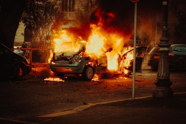 Exploded car on the side of the road 