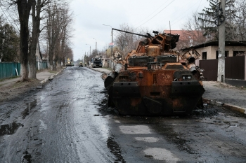 tank in the middle of a street in Bucha, Ukraine