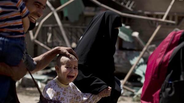 A child cries leaving Mosul, in May 2017.  