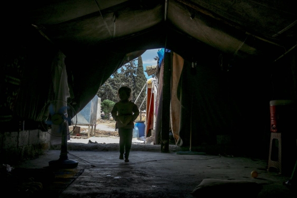 Child walking in tent