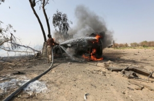 A car destroyed in a landmine explosion.