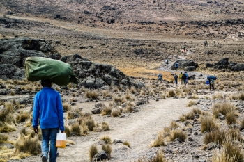 People walking in a desolate valley in Africa 
