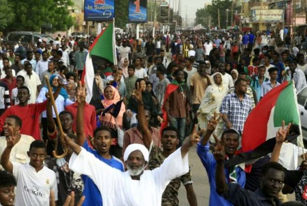 Thousands of pro-democracy demonstrators protest the military rule in Khartoum, Sudan on 30 June.