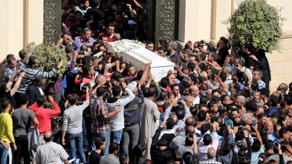 Mourners attend the funeral of those killed in the bus attack targeting Coptic Christians