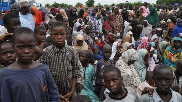 Civilians take refuge at a school in Maiduguri after fleeing a Boko Haram attack in Bama 