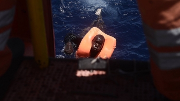A migrant wearing a lifejacket during a rescue in the Mediterranean Sea