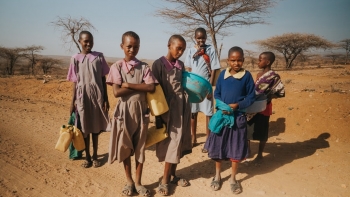 Six children standing in the desert, Sware, Kenya. 