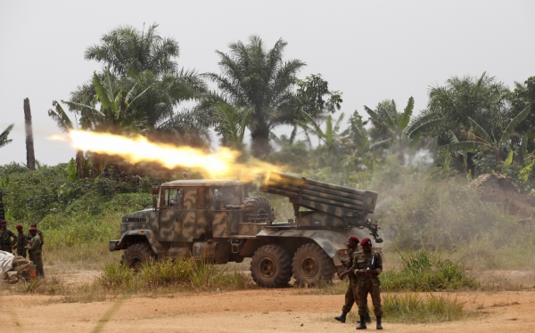 Congolese soldiers from the Armed Forces of the Democratic Republic of Congo (FARDC) launch missiles during their military operation against ADF-NALU rebels outside the town of Beni, in North Kivu province
