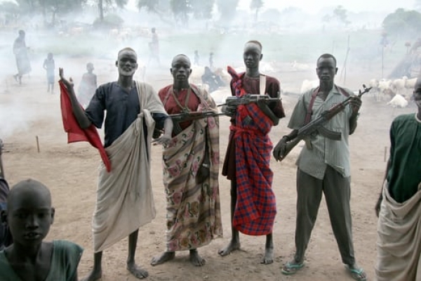 Four men holding assault rifles in South Sudan