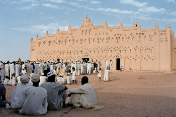 People gathering in front of mosque in Sahel