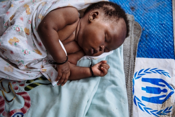 A one-month-old baby girl from South Sudan sleeps on a mat in Bidibidi refugee settlement, Uganda.