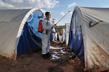 Disinfection practices at a camp for displaced people in Kafr Jalis village, Syria