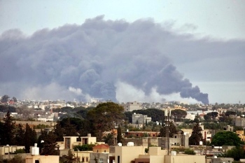 Earlier this month, smoke rises over Tripoli after shelling by Haftar’s NLA 