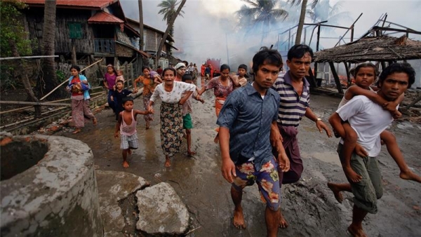 Rohingya people, a persecuted Muslim population, fleeing their homes