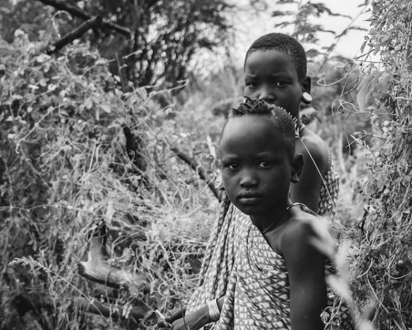 Girls between bushes in Hamer, Ethiopia.