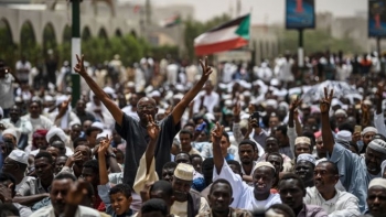 Civilians protest outside the military headquarters in Sudan’s Khartoum.