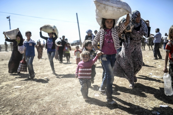 Civilian population, especially women and children, running away from war 