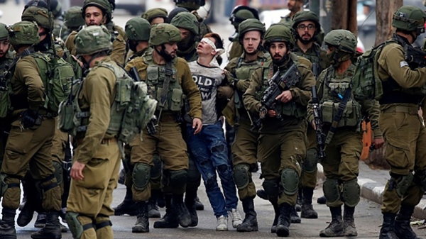 Arrest of Fawzi al-Junaidi, 16 years old Palestinian boy, accused of throwing stones.