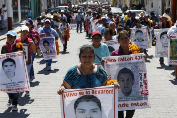 Relatives of 43 missing students marching and demanding justice 