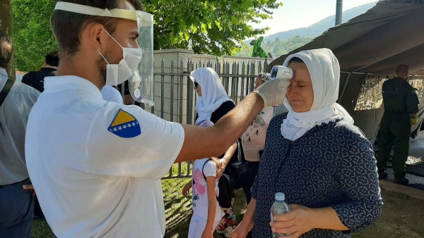 Temperature check at the entrance of the Srebrenica Memorial Centre on the day of the commemorations