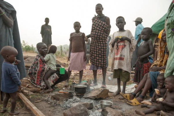 Refugees prepare coffee for breakfast in displaced persons camp in Juba, South Sudan