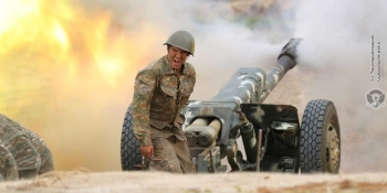 Armenian soldier firing an artillery piece during fighting with Azerbaijan’s forces  