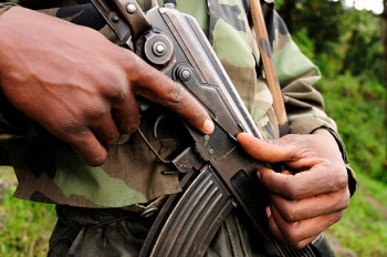 An African soldier holding a rifle