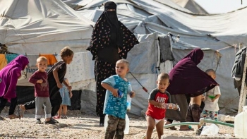 Women look after children at the Kurdish-run al-Hol camp