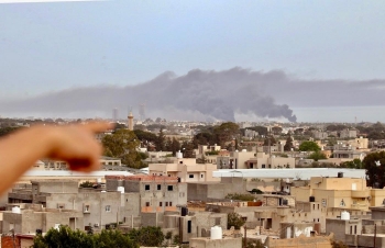 Smoke rising above buildings in Libyan capital Tripoli during reported shelling by Khalifa Haftar&#039;s forces earlier this month