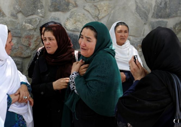 Afghan women mourn outside a hospital after the truck bomb in Kabul