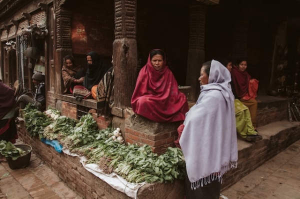 Women selling vegetables in the arcades of Bhaktapur, Nepal.